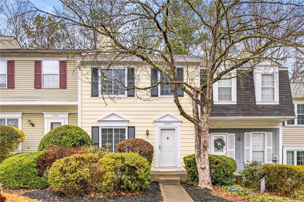 View of front of property with roof with shingles