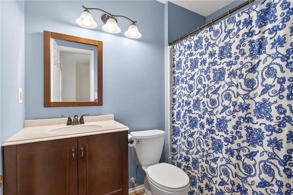Bathroom featuring vanity and a shower with curtain