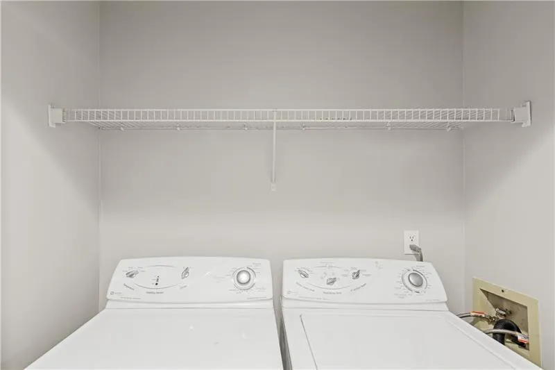 Laundry room with washing machine and clothes dryer