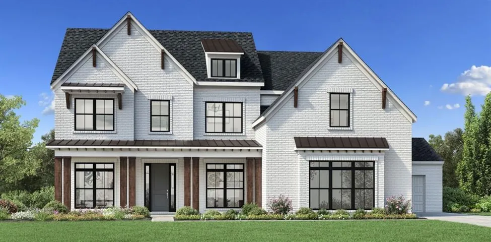 White brick exterior with prominent gables and dark window frames