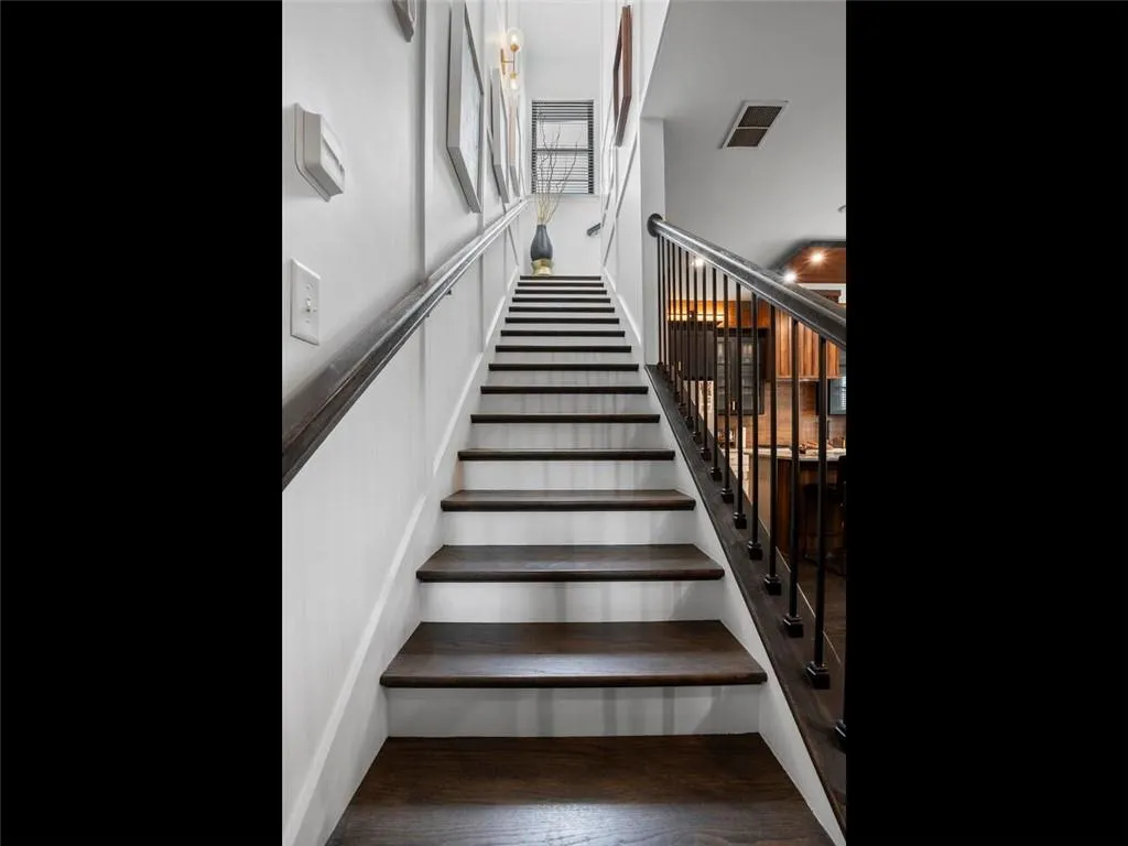 Stairway with custom wall molding and specialty lighting