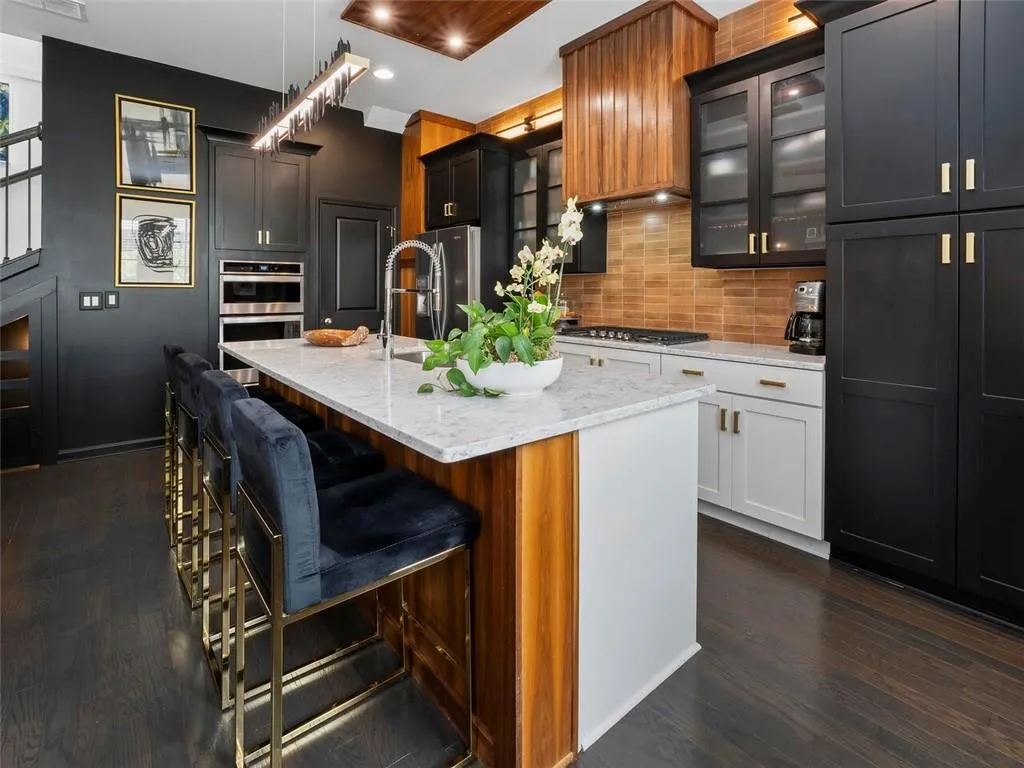 Calcutta quartz countertops with brushed nickel whirlpool appliances