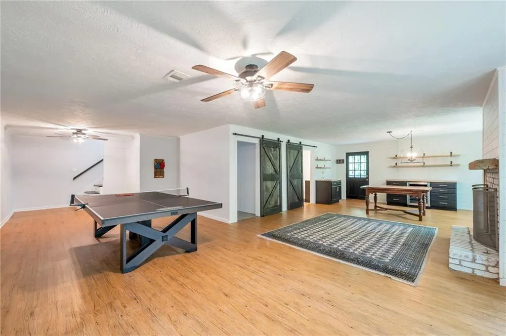 Terrace level game room with fireplace