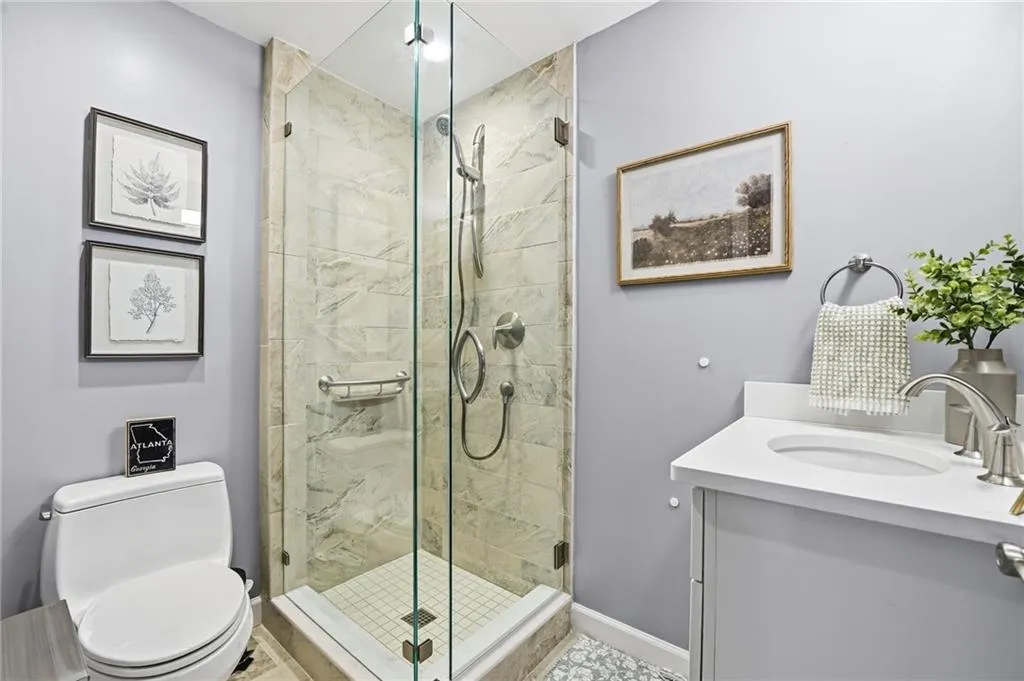 Bathroom with vanity and a stall shower