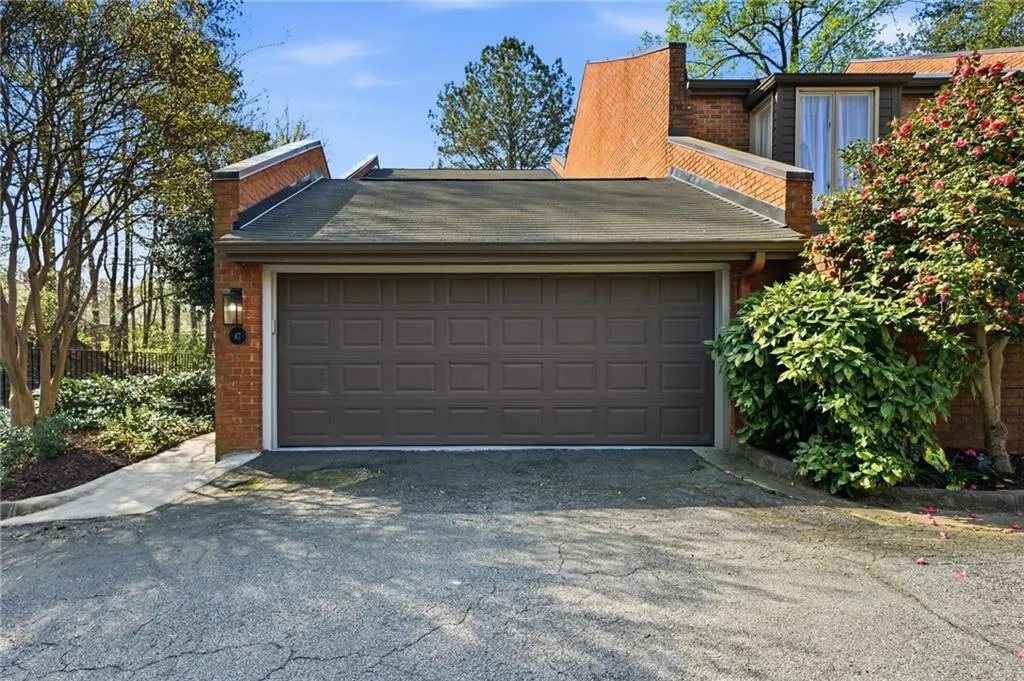 Garage featuring driveway