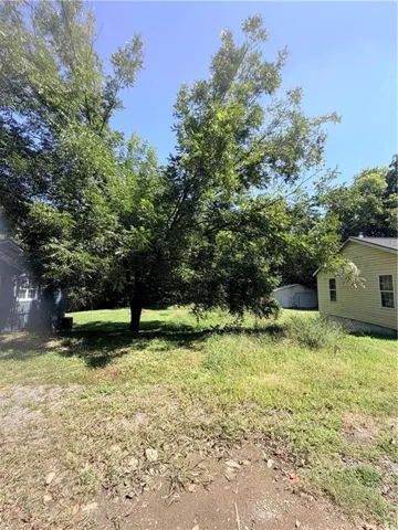 Spacious lot featuring mature shade trees and established landscaping, with two single-family residences situated on the property