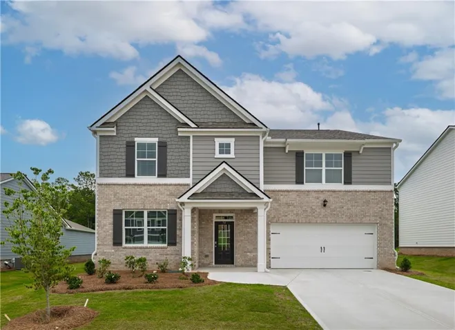 Two-story residence featuring a brick and siding exterior, a covered entry, a two-car garage, and a concrete driveway