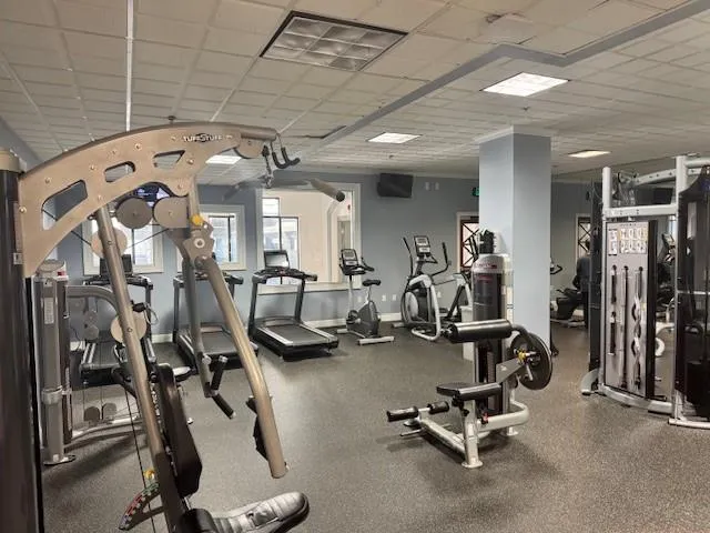 Exercise room featuring a drop ceiling