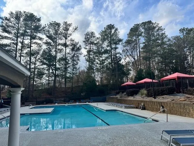 View of swimming pool featuring a patio