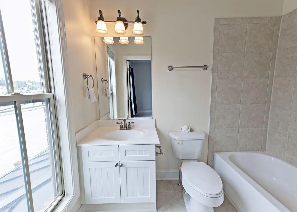 Full Bathroom On-Suite with Vanity, Tub/Shower Combo, and Tile Floors.