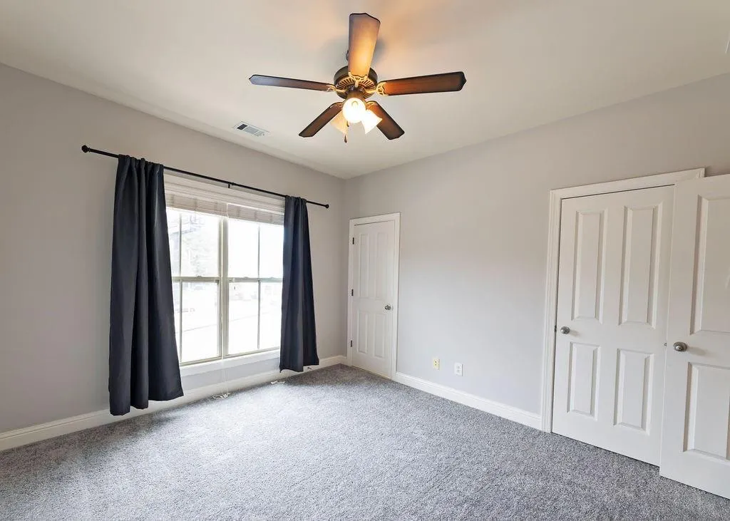 2nd Bedroom On Upper Level With New Carpets, Ceiling Fan and Bright-Light Window.