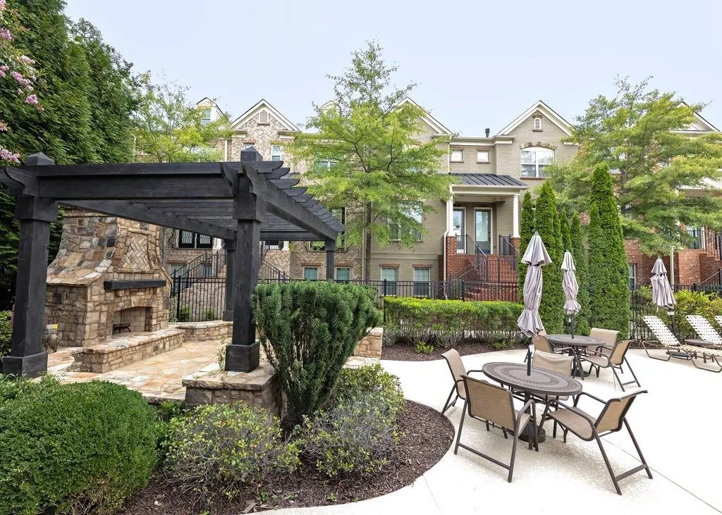 Great Communal Swimming Pool Area and Patio with outdoor Fireplace and Pergola.