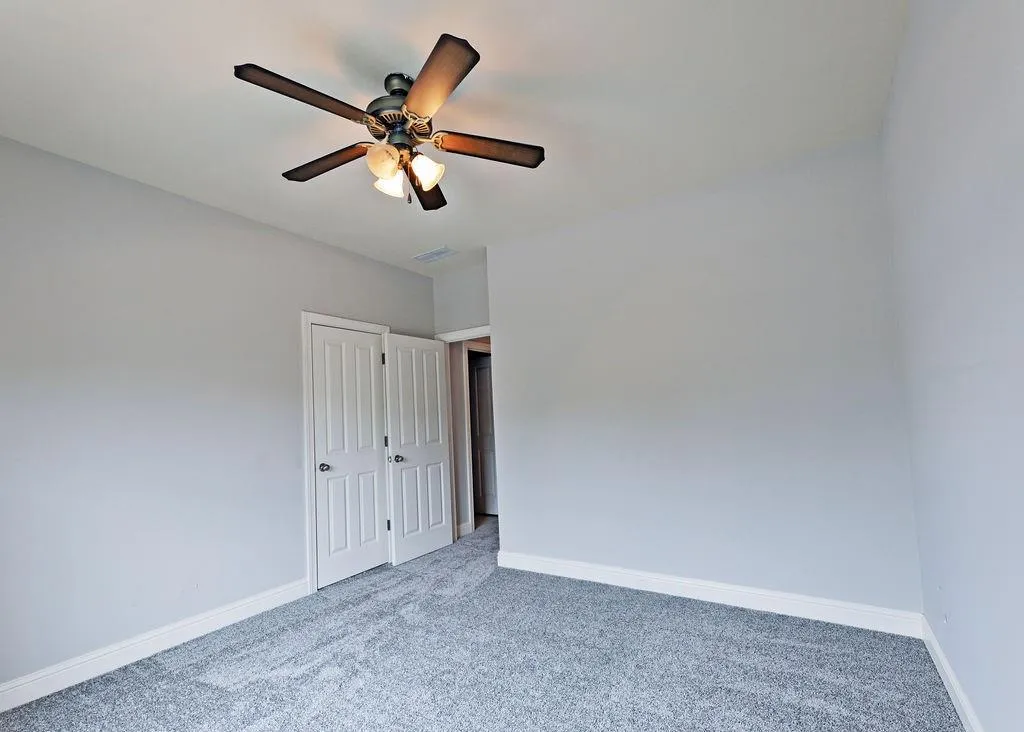 2nd Bedroom On Upper Level With New Carpets, Ceiling Fan and Bright-Light Wiondow.
