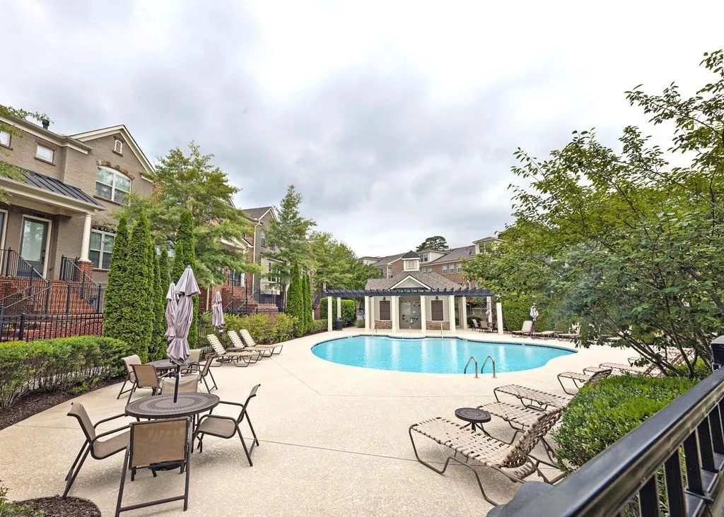 Great Communal Swimming Pool Area and Patio with outdoor Fireplace and Pergola.