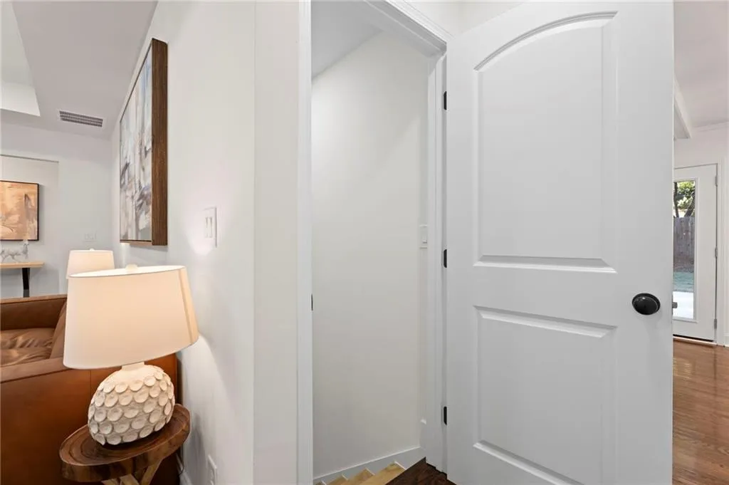 Arch-top paneled door with matte black hardware