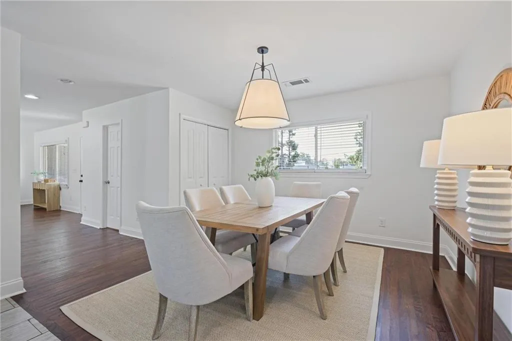 Dining area with dark wood finished floors and baseboards Dining area with dark wood finished floors and baseboards