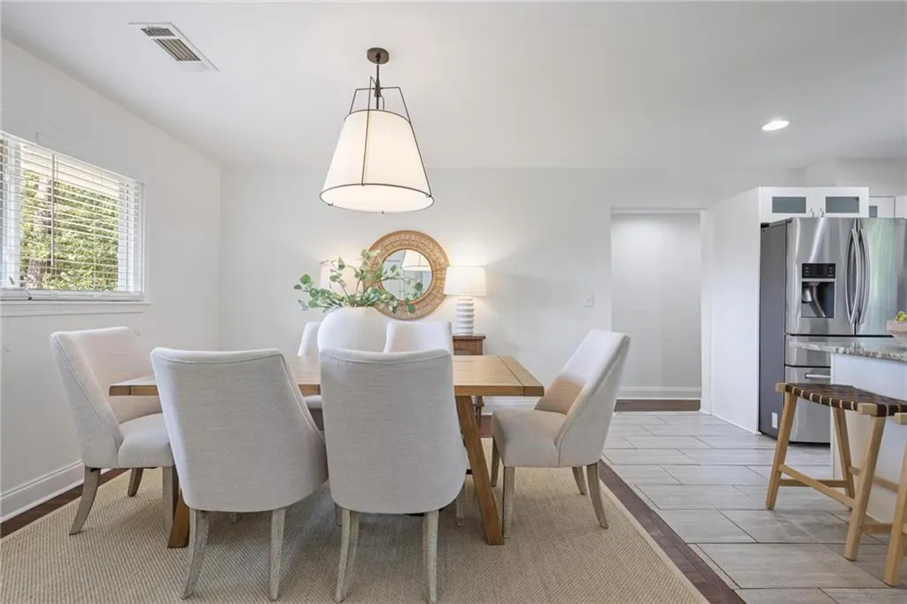 Dining room with wood tiled floors and recessed lighting Dining room with wood tiled floors and recessed lighting