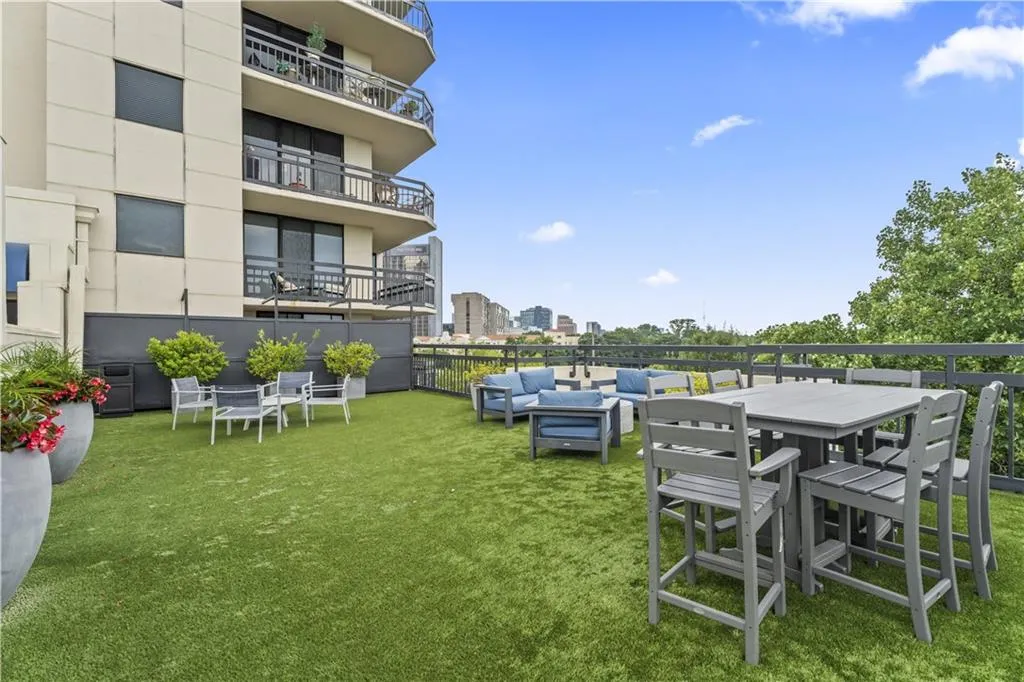 View of grassy yard with outdoor lounge area