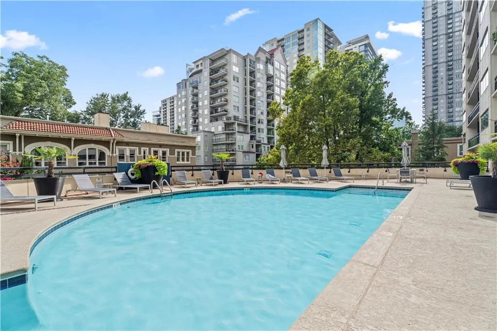 Community pool with a patio