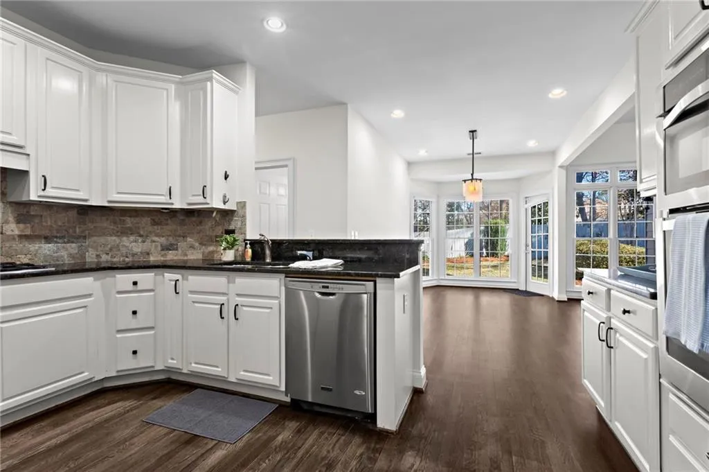Kitchen with Breakfast Bar and Stainless Steel Appliances