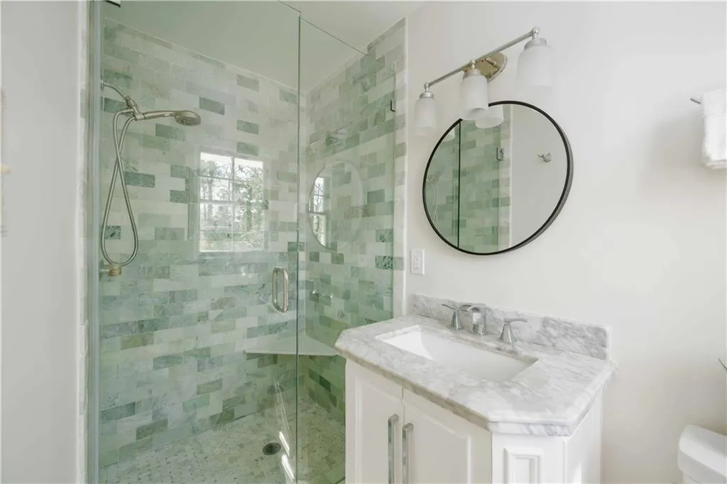 Primary Bathroom features marble