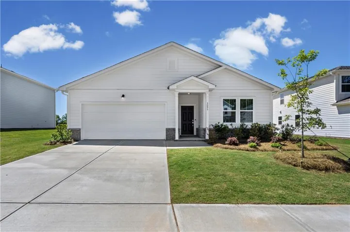 Modern single-story residence featuring white siding and a covered entry