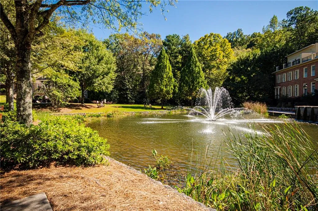 Pond view with a tree filled landscape...A gorgeous place to live!