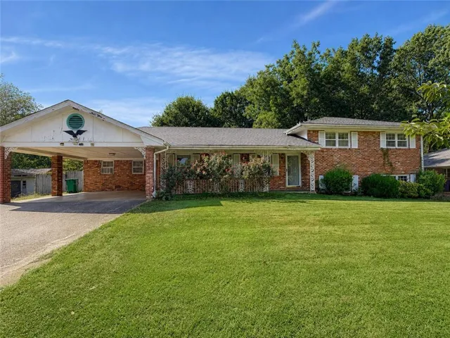 Brick exterior with white window shutters