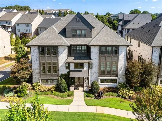 White brick exterior with dark trim accents