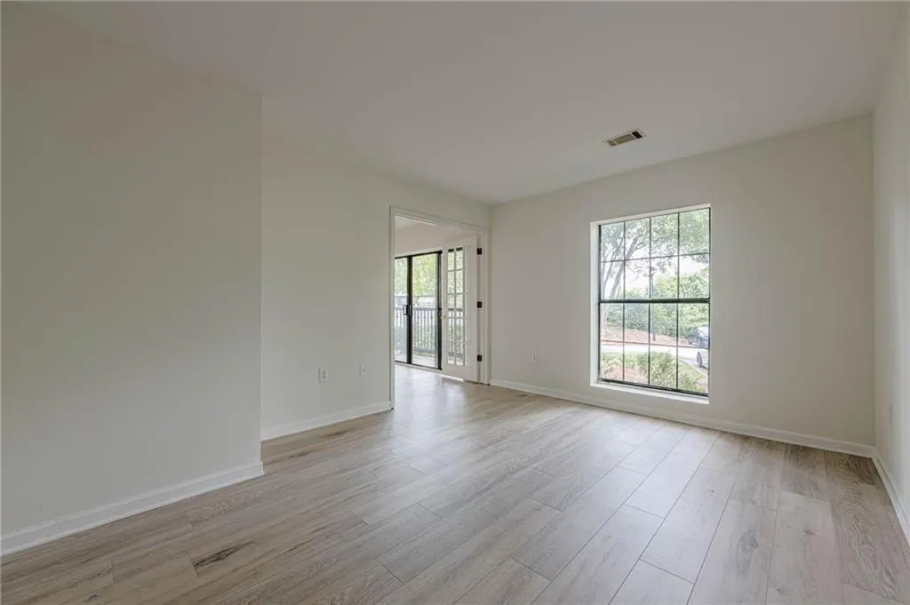 Spare room featuring light wood-type flooring