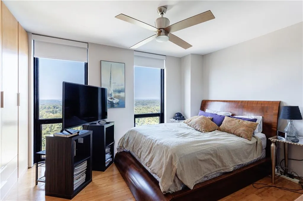 Primary Bedroom with floor to ceiling windows