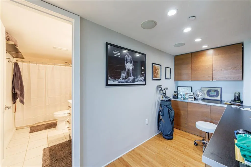 Office with recessed lighting and custom cabinetry