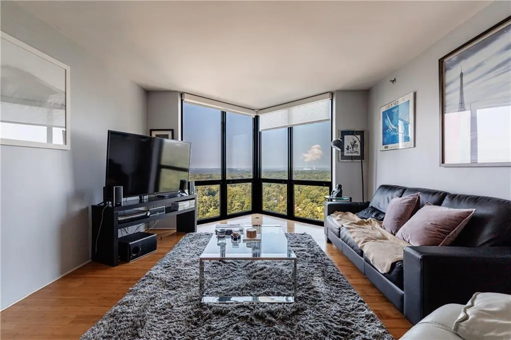 Living area featuring floor to ceiling windows on 27th floor