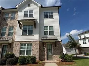 Brick and siding exterior with multiple windows