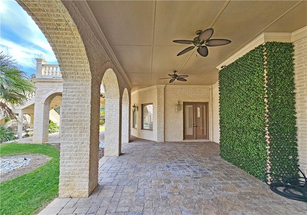 View of terrace featuring ceiling fan