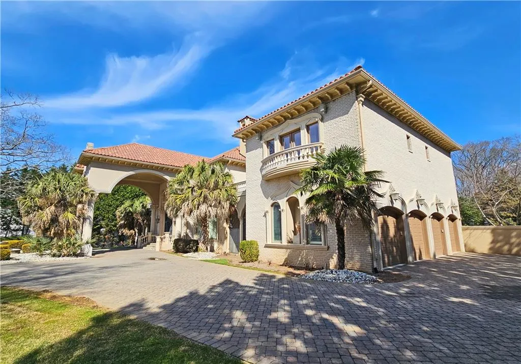 Mediterranean / spanish house featuring a garage