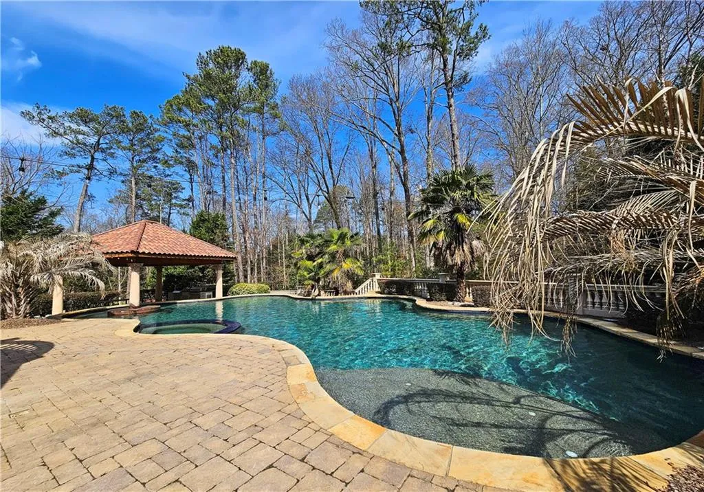View of swimming pool with a gazebo