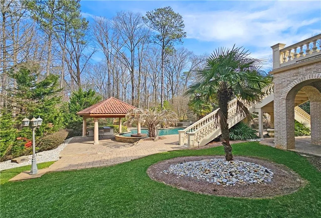 View of yard featuring a gazebo, a balcony, and a patio