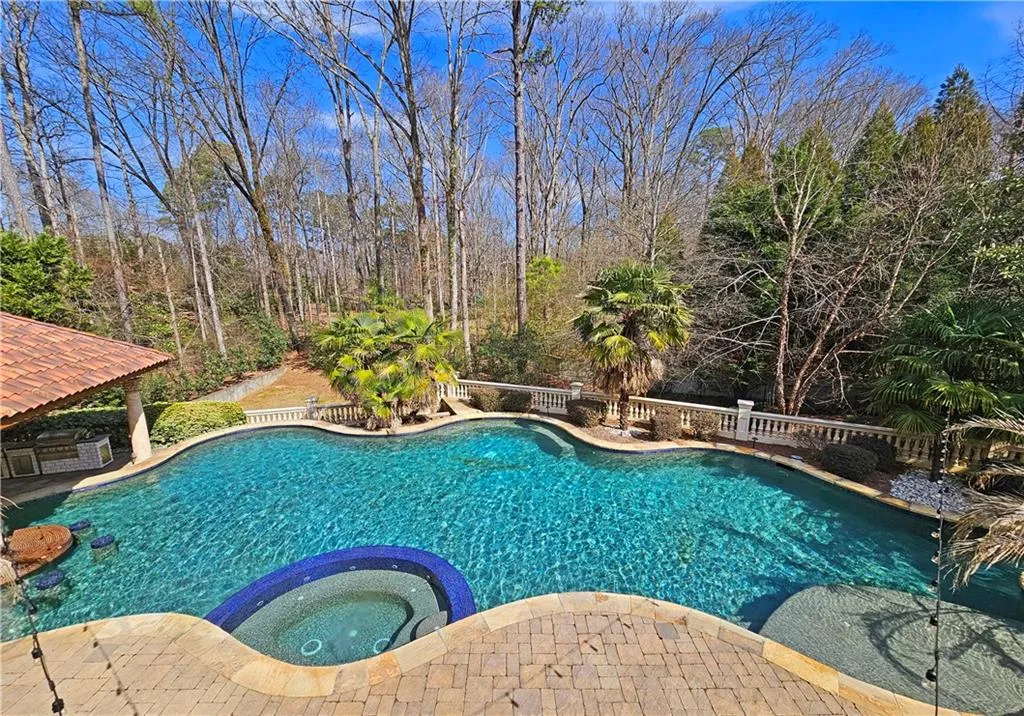 View of pool featuring an in ground hot tub
