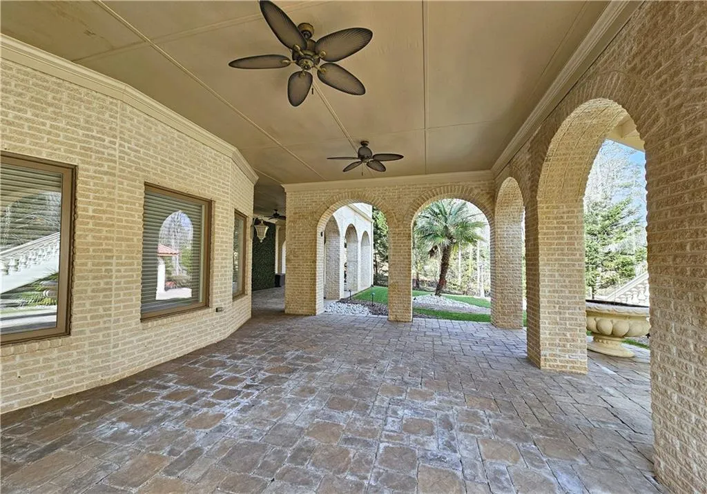 View of patio featuring ceiling fan
