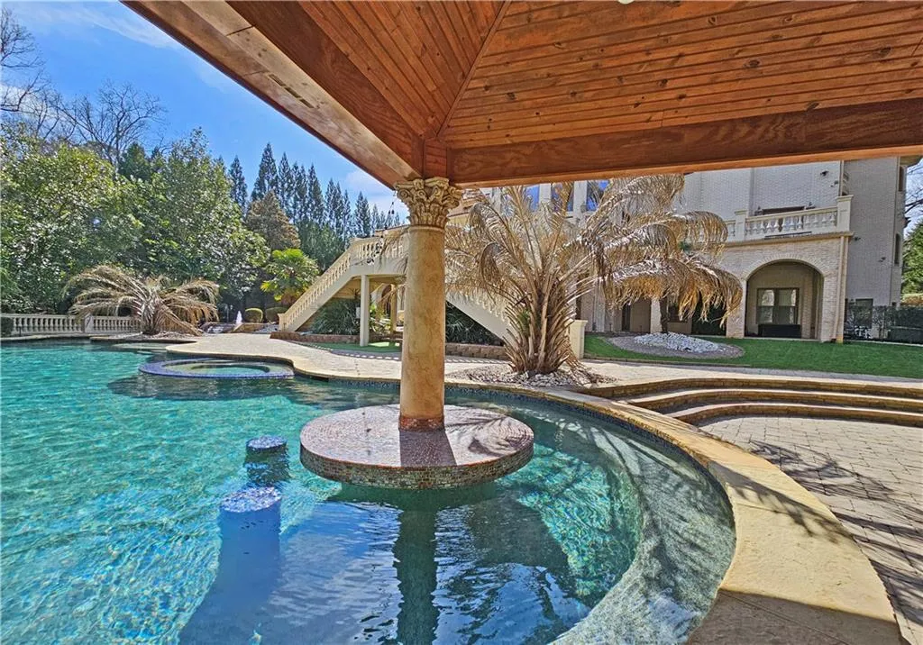 View of pool featuring an in ground hot tub