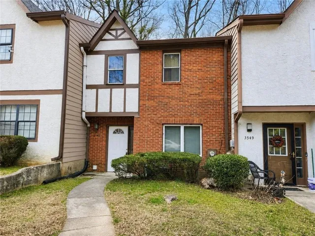 Welcome to this inviting townhome rental featuring classic brick and stucco details with timeless Tudor-inspired character. Surrounded by mature trees, the home offers a charming exterior and a comfortable setting that feels warm and welcoming from the moment you arrive.
