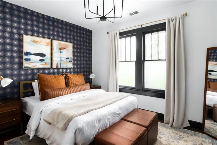 Bedroom featuring a chandelier