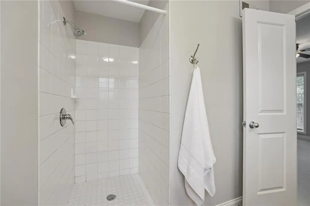 Full bath with a tile shower