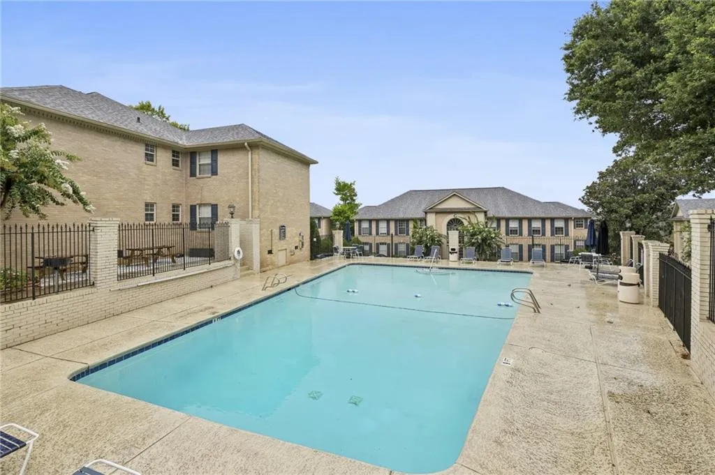 Community pool featuring a patio area