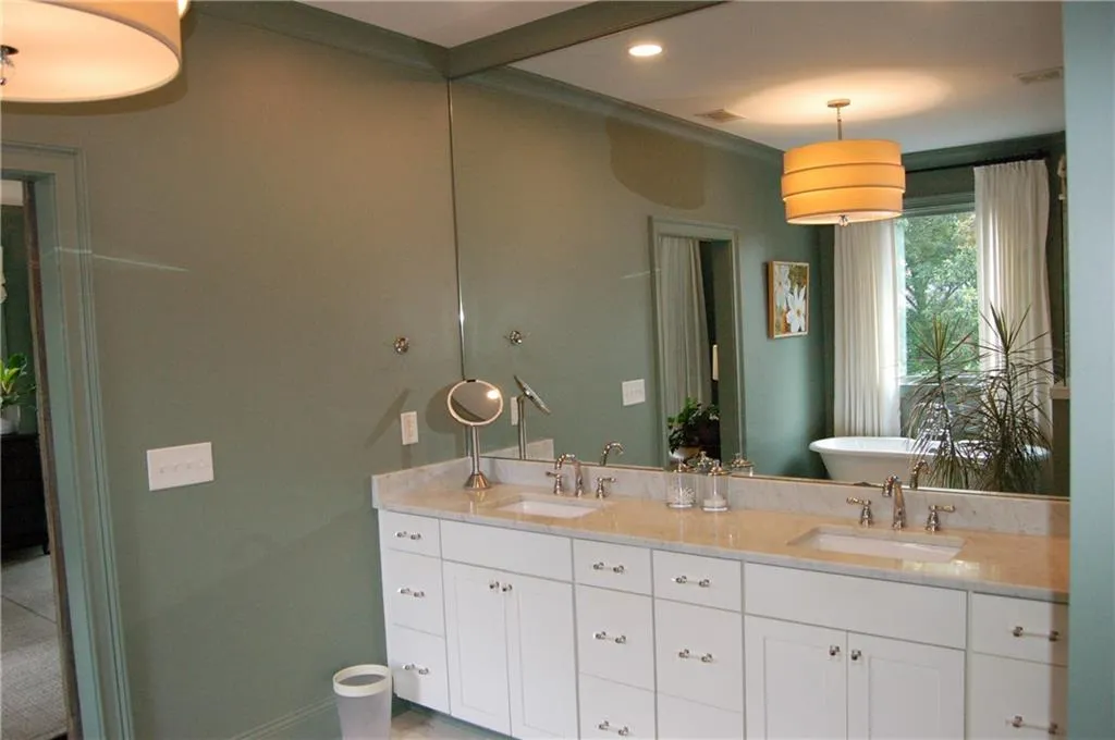 Custom cabinetry with dual vanities.