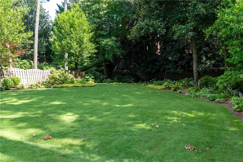 Absolutely FANTASTIC, private, professional landscaped and fenced back yard.