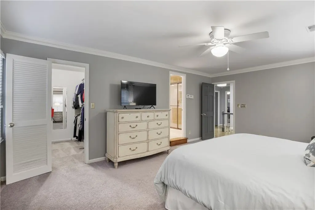 Spacious primary suite with walk-in closet and separate accessory closet