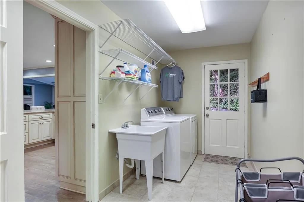 Spacious laundry room with washing machine and dryer