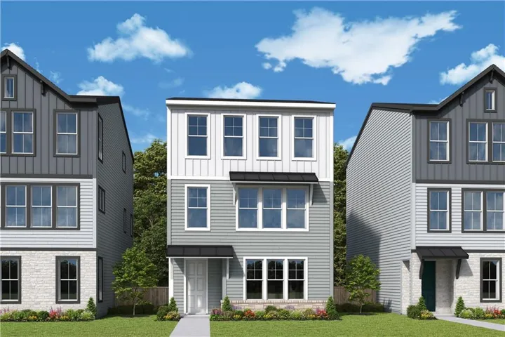 Three-story residence featuring a combination of horizontal siding, vertical siding, and brick veneer